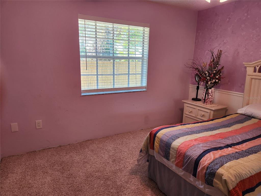 1137 Ponderosa Road Venice, FL 34293 - Photo 30 of 48 a bedroom with a bed and window