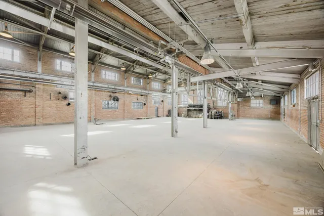 a view of a garage with wooden floors