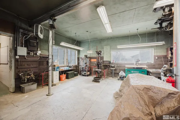 a view of parking garage with cars