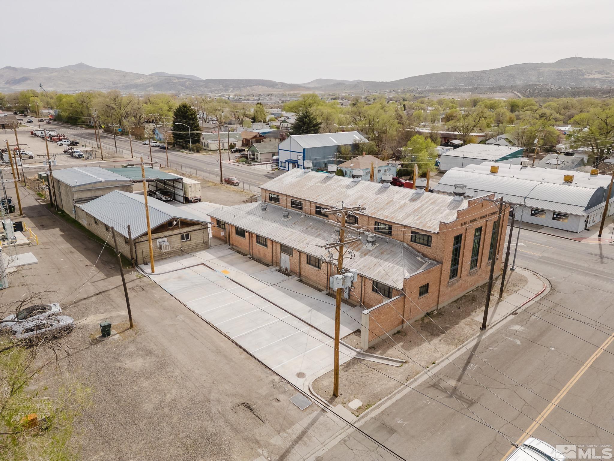 240 7th Street Elko, NV 89801 - Photo 8 of 40 a picture of a city with lots of residential buildings and mountain view in back