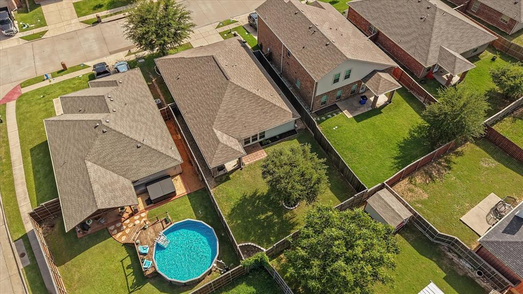 409 Harding Lane Lavon, TX 75166 - Photo 32 of 34 Expansive backyard featuring a circular above-ground pool, a multi-level wood deck, and a stone patio
