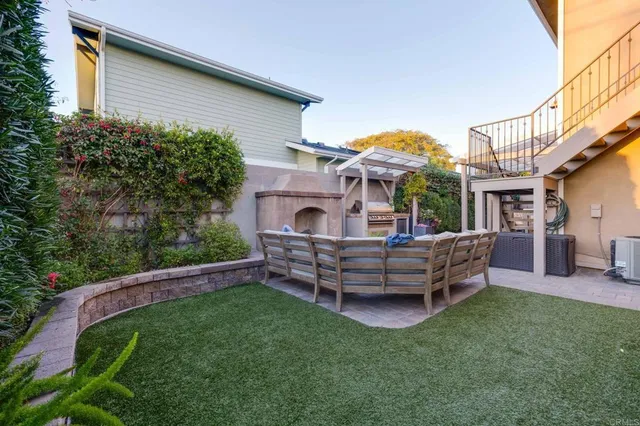 a outdoor living space with furniture and a potted plant