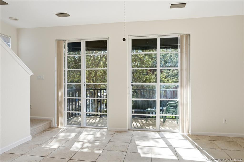 103 Cat Rock Lane Jupiter, FL 33458 - Photo 11 of 32 a view of empty room with windows