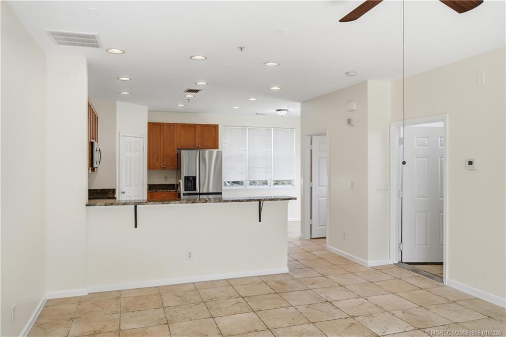 103 Cat Rock Lane Jupiter, FL 33458 - Photo 13 of 32 a view of kitchen with center island and stainless steel appliances