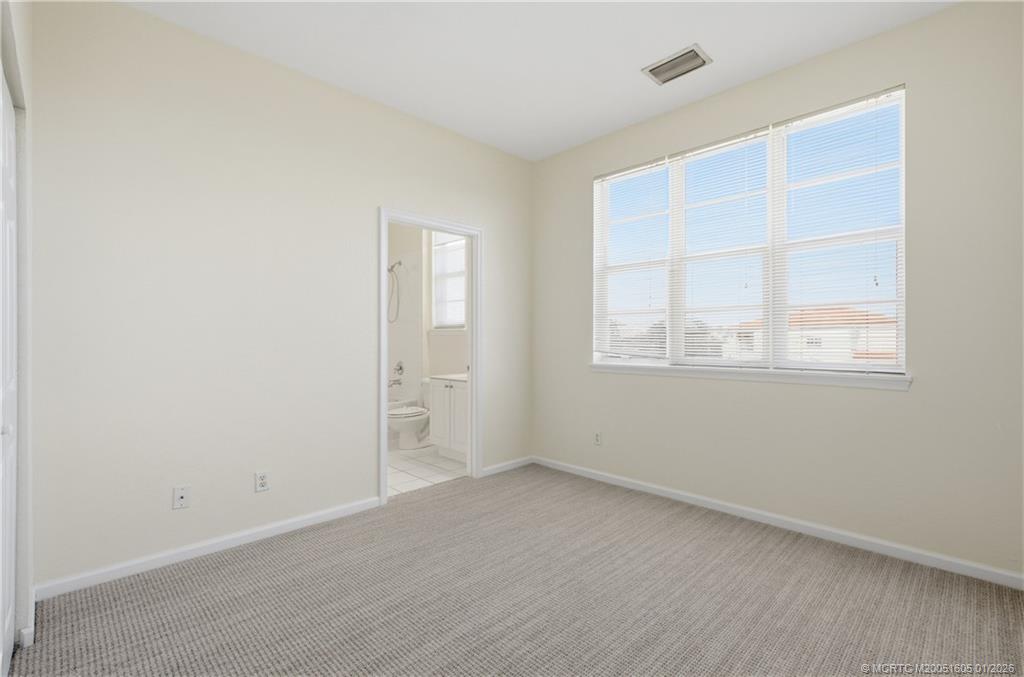 103 Cat Rock Lane Jupiter, FL 33458 - Photo 23 of 32 an empty room with windows