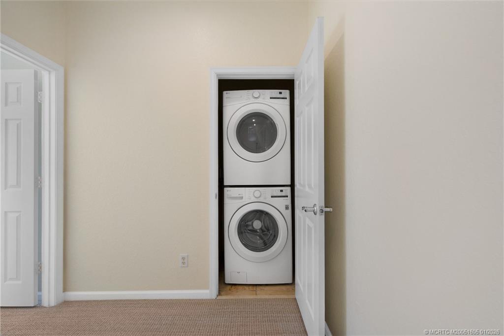 103 Cat Rock Lane Jupiter, FL 33458 - Photo 30 of 32 a utility room with dryer and washer