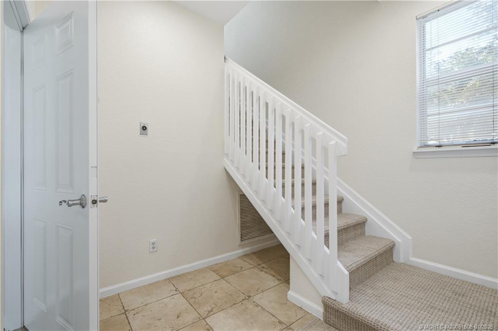 103 Cat Rock Lane Jupiter, FL 33458 - Photo 5 of 32 a view of entryway and hall with wooden floor