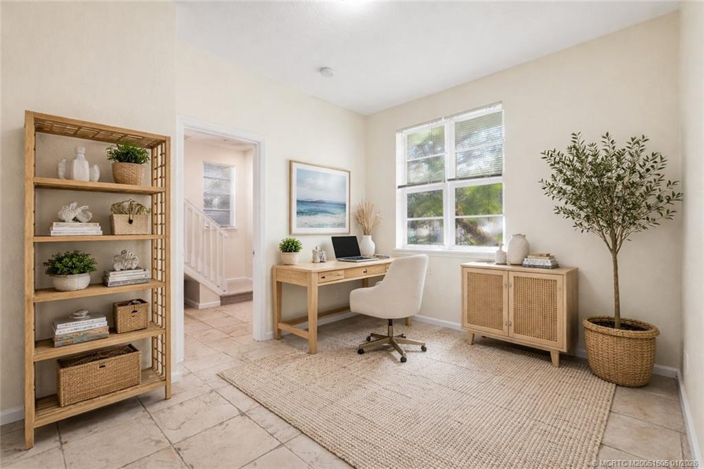 103 Cat Rock Lane Jupiter, FL 33458 - Photo 6 of 32 a view of a workspace with furniture and a window