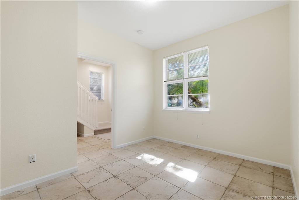 103 Cat Rock Lane Jupiter, FL 33458 - Photo 7 of 32 an empty room with windows
