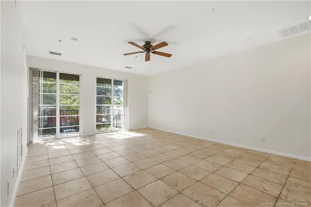 a view of kitchen with center island and stainless steel appliances