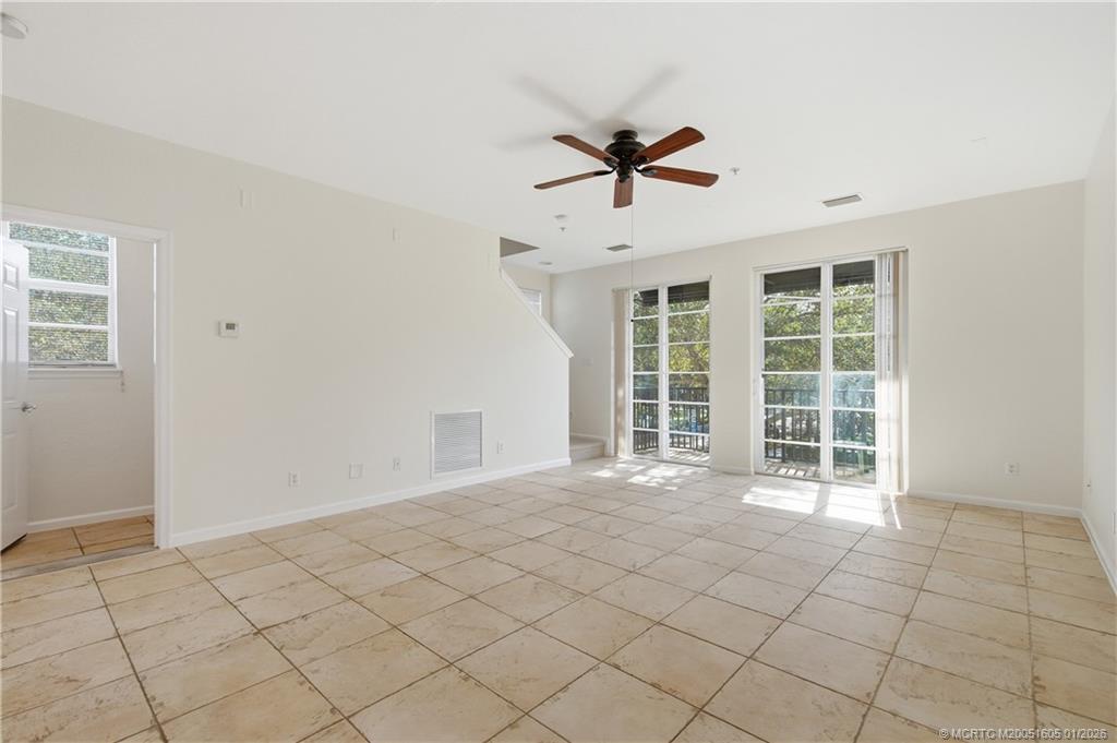 103 Cat Rock Lane Jupiter, FL 33458 - Photo 9 of 32 a view of an empty room and window