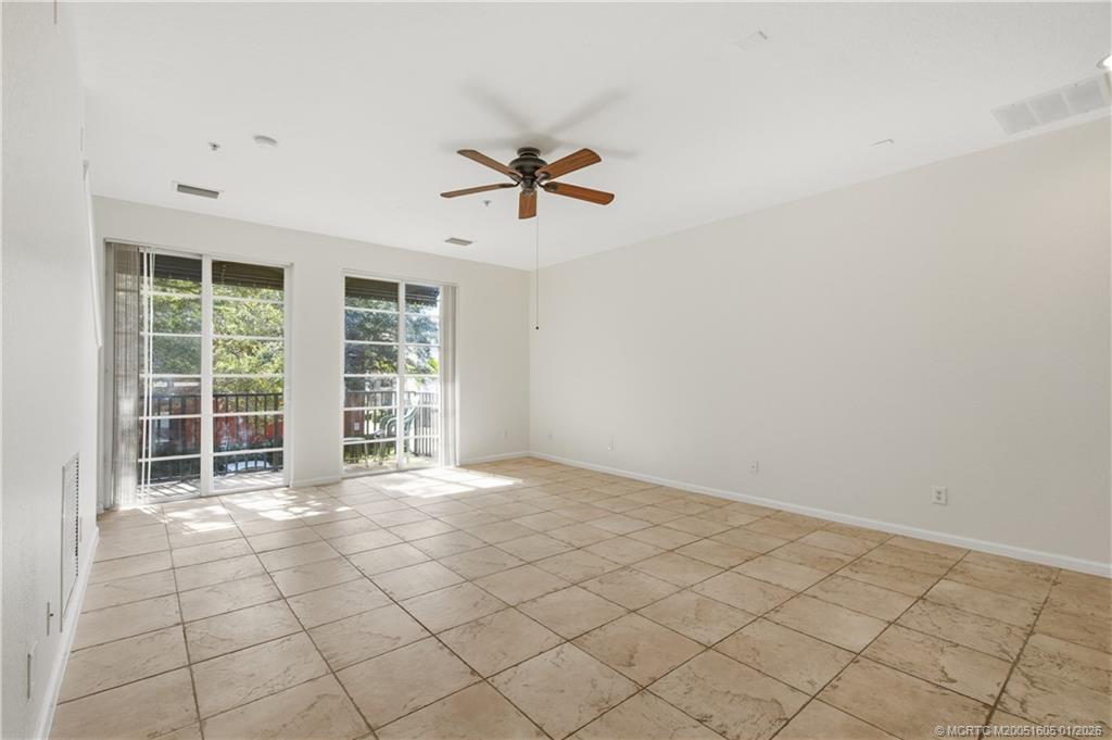 103 Cat Rock Lane Jupiter, FL 33458 - Photo 10 of 32 an empty room with windows