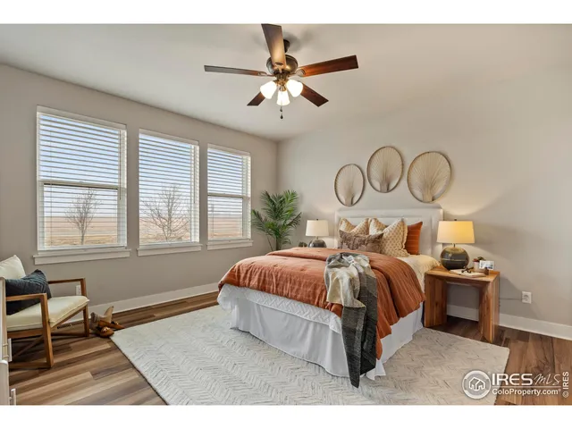 a spacious bedroom with a bed and window