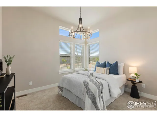 a bedroom with bed and window