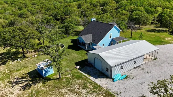 a view of a garden with a building in the background