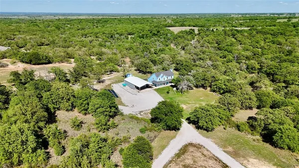 a view of a back yard of the house