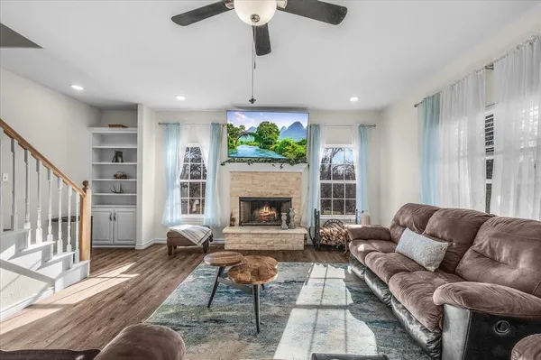 a living room with furniture fireplace and a fireplace