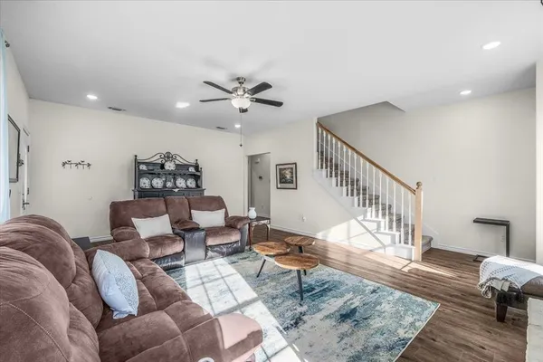 a living room with furniture and a rug