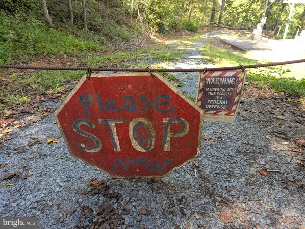 a view of a wooden fence with a view of outdoor space