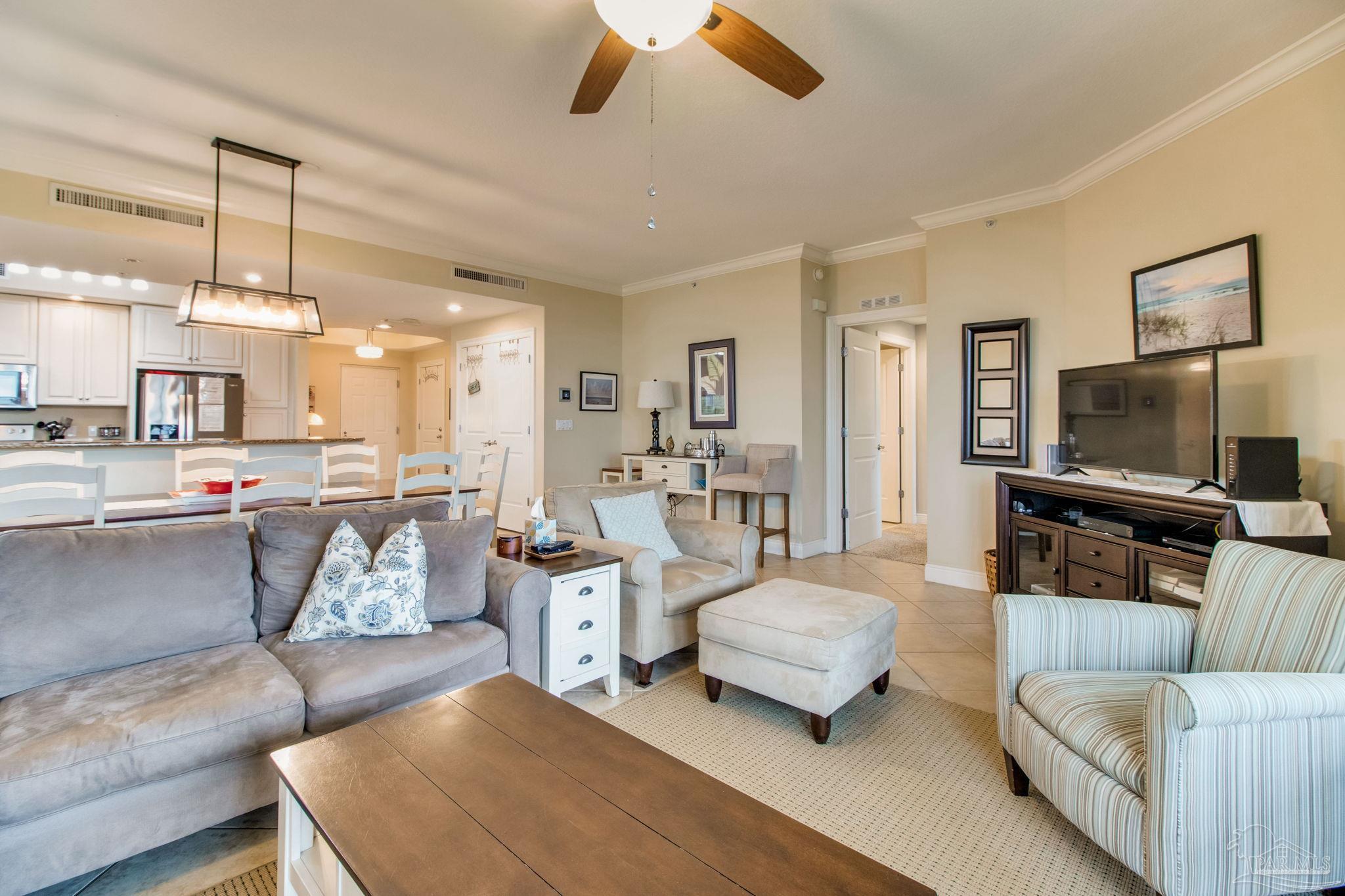 612 Lost Key Drive, Unit 405B Pensacola, FL 32507 - Photo 11 of 71 a living room with furniture and a flat screen tv