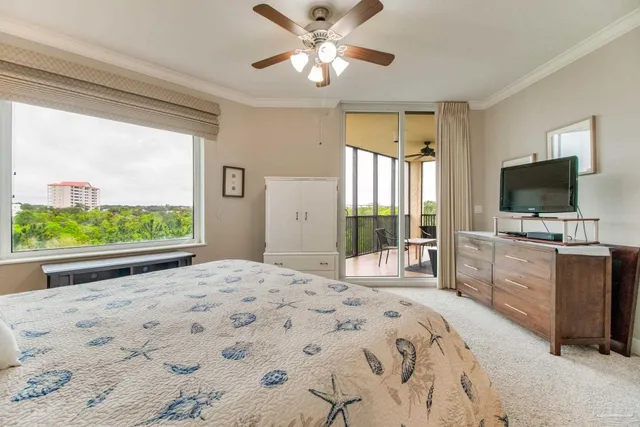 a living room with furniture kitchen view and a chandelier