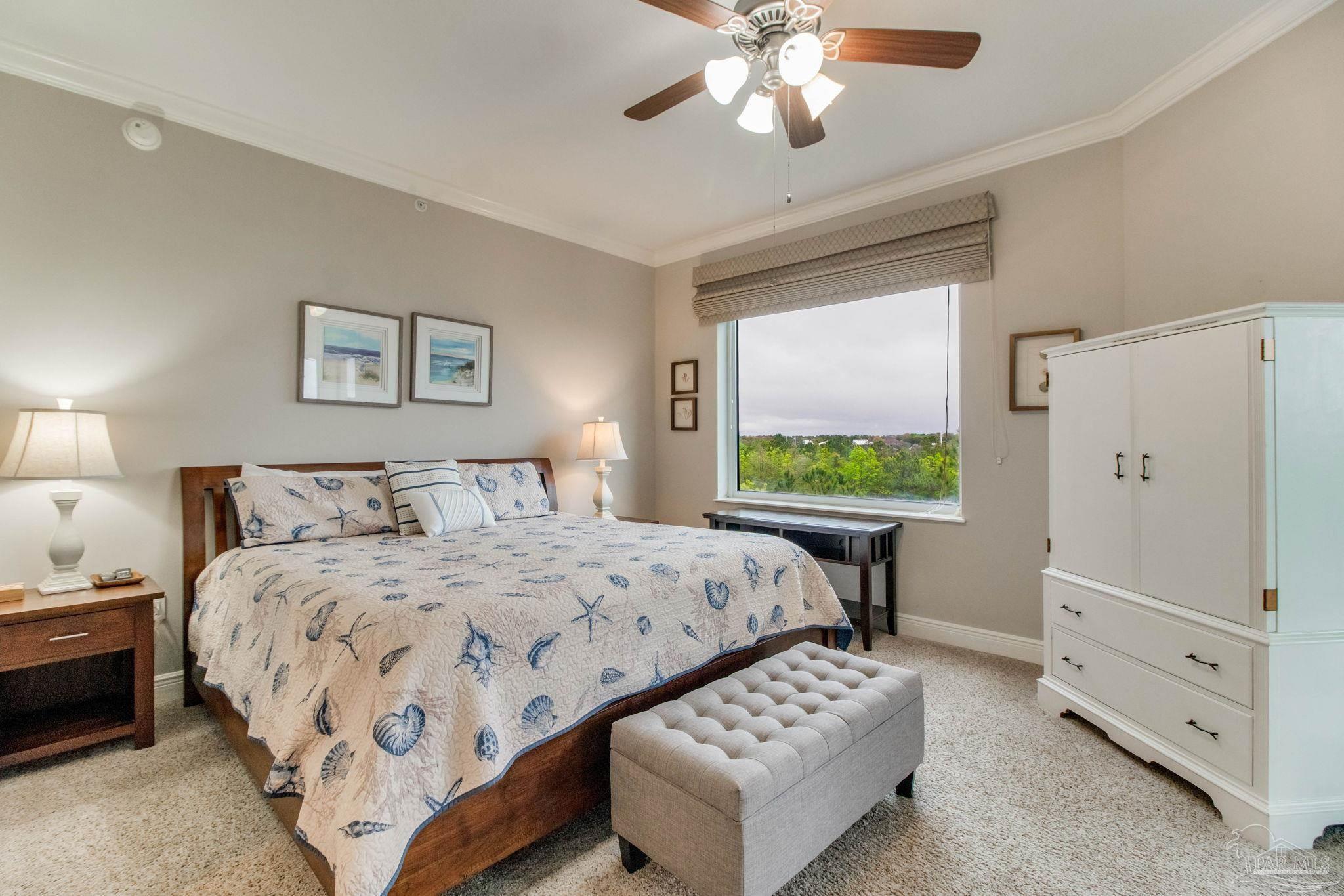 612 Lost Key Drive, Unit 405B Pensacola, FL 32507 - Photo 26 of 71 a bedroom with a bed and a dresser