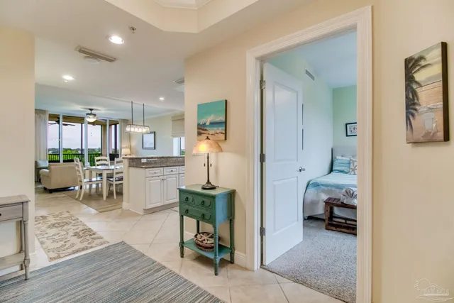 a bedroom with double bed and a chandelier