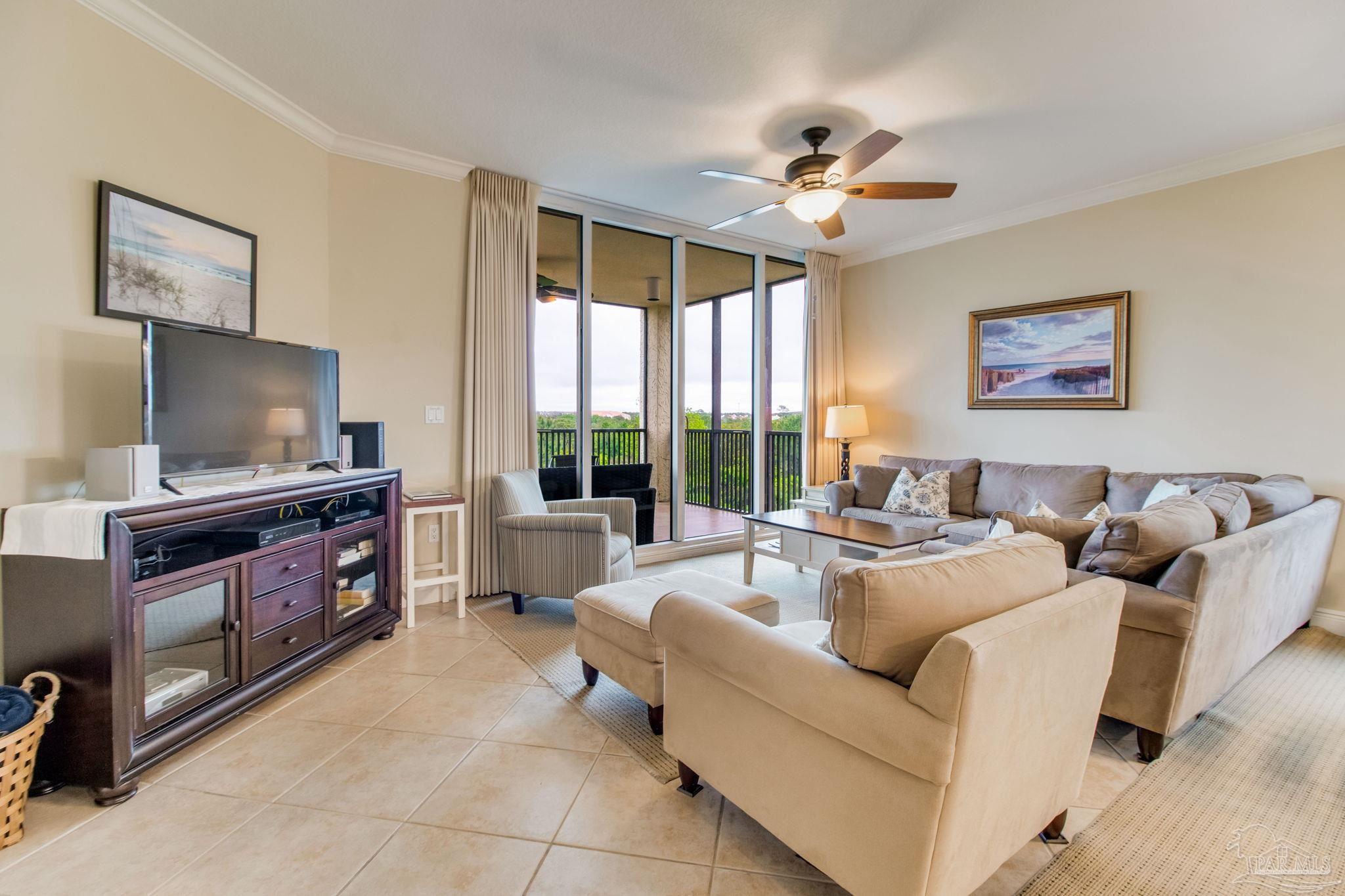 612 Lost Key Drive, Unit 405B Pensacola, FL 32507 - Photo 31 of 71 a living room with furniture and a flat screen tv
