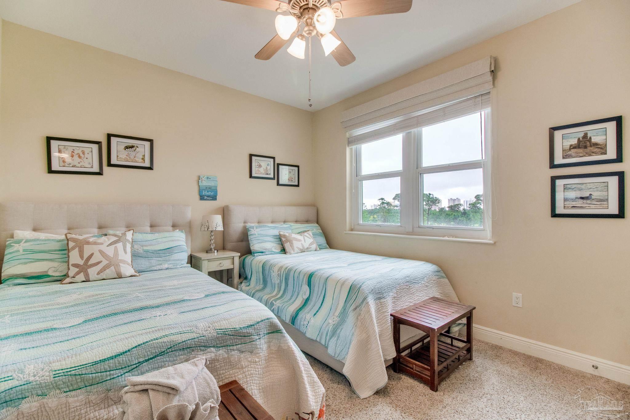 612 Lost Key Drive, Unit 405B Pensacola, FL 32507 - Photo 41 of 71 a bedroom with two beds and a window