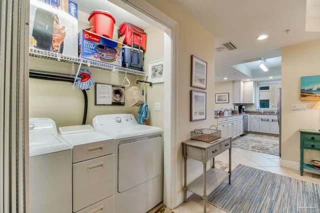 a view of living room kitchen and patio