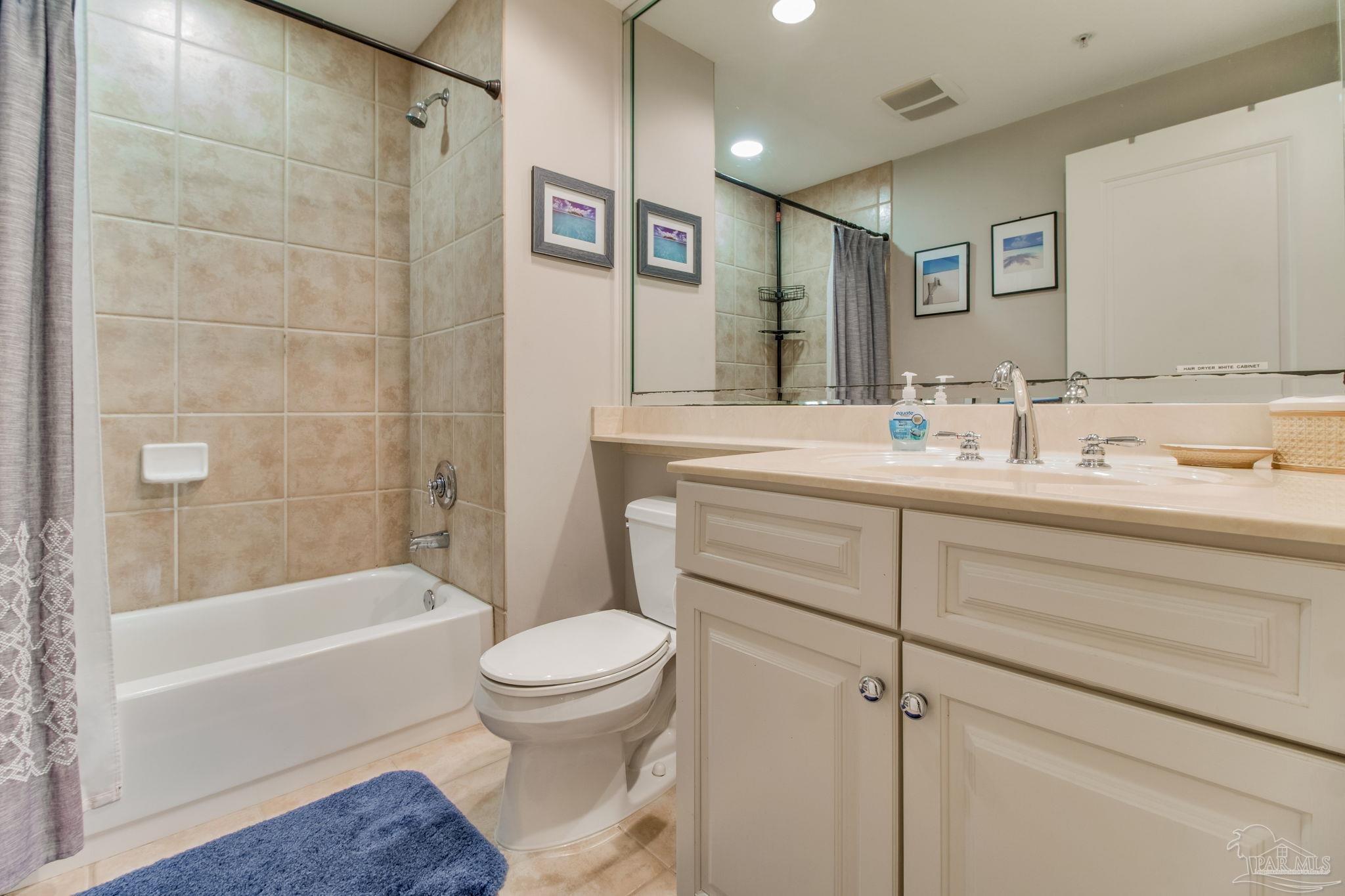 612 Lost Key Drive, Unit 405B Pensacola, FL 32507 - Photo 48 of 71 a bathroom with a sink toilet and shower