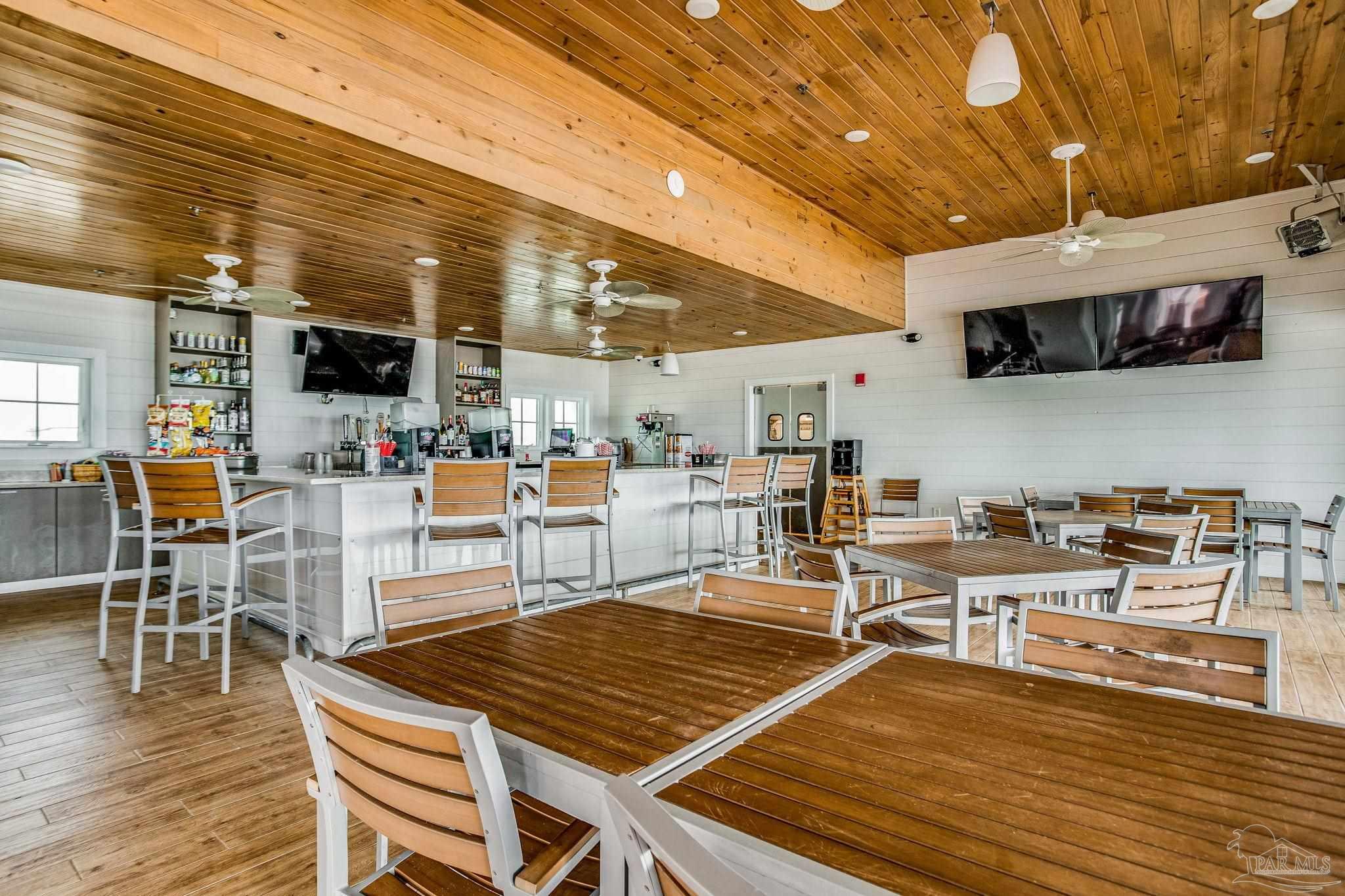 612 Lost Key Drive, Unit 405B Pensacola, FL 32507 - Photo 64 of 71 a outdoor space with lots of furniture