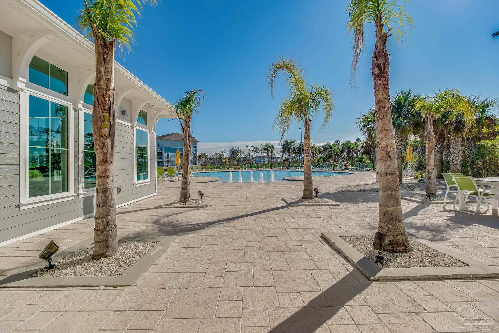 612 Lost Key Drive, Unit 405B Pensacola, FL 32507 - Photo 66 of 71 a view of a house with palm trees