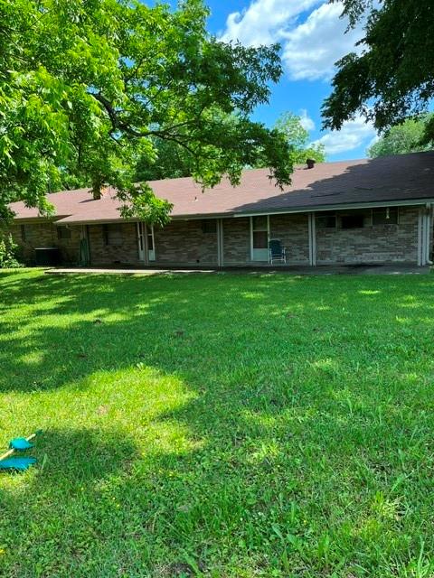 304 Sunset Street Roxton, TX 75477 - Photo 29 of 31 a front view of a house with a garden