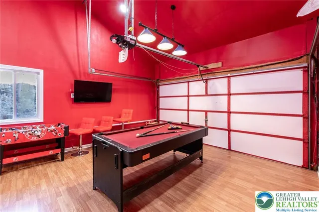 a reading room with furniture and wooden floor