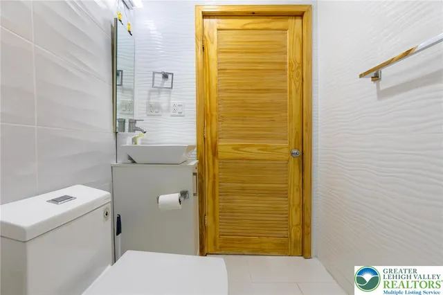 a bathroom with a toilet and shower