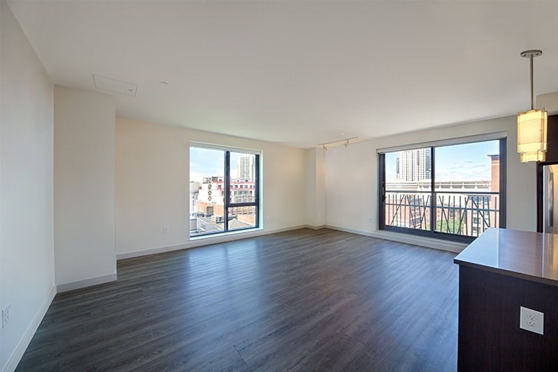 1 Canal Street, Unit 804 Boston, MA 02114 - Photo 4 of 12 a view of an empty room with wooden floor and a window