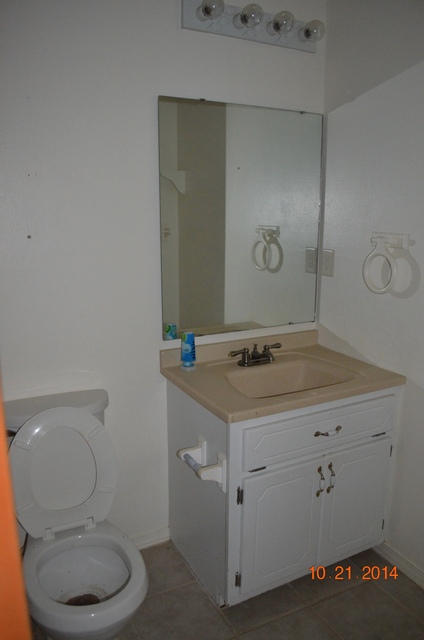 166 Ridge Lake Road Crestview, FL 32536 - Photo 14 of 19 a bathroom with a granite countertop toilet and a sink