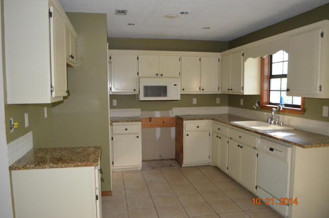 166 Ridge Lake Road Crestview, FL 32536 - Photo 5 of 19 a kitchen with cabinets appliances a sink and a counter top