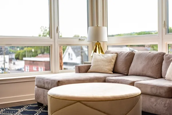 a living room with a couch and a large window