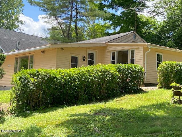 263 Shore Road Richmond, MA 01201 - Photo 1 of 21 a front view of a house with a yard