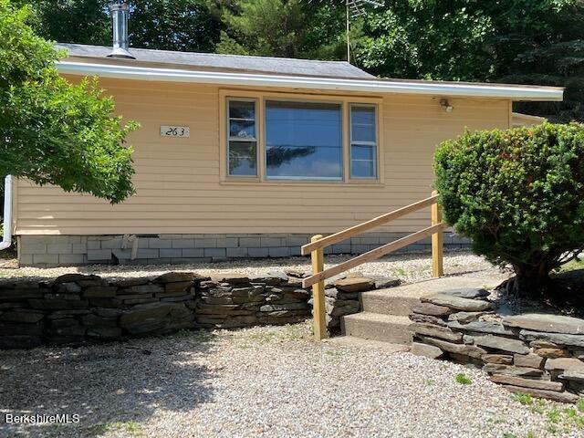 263 Shore Road Richmond, MA 01201 - Photo 2 of 21 a view of backyard with wheel chair and potted plants