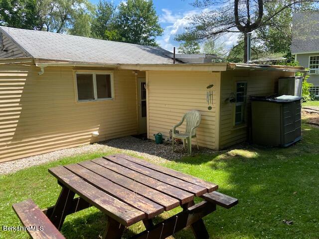 263 Shore Road Richmond, MA 01201 - Photo 8 of 21 a backyard of a house with barbeque oven table and chairs