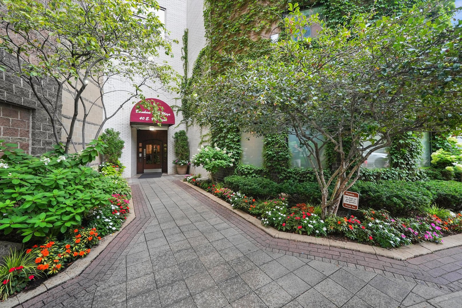 a sign that is in front of flowers