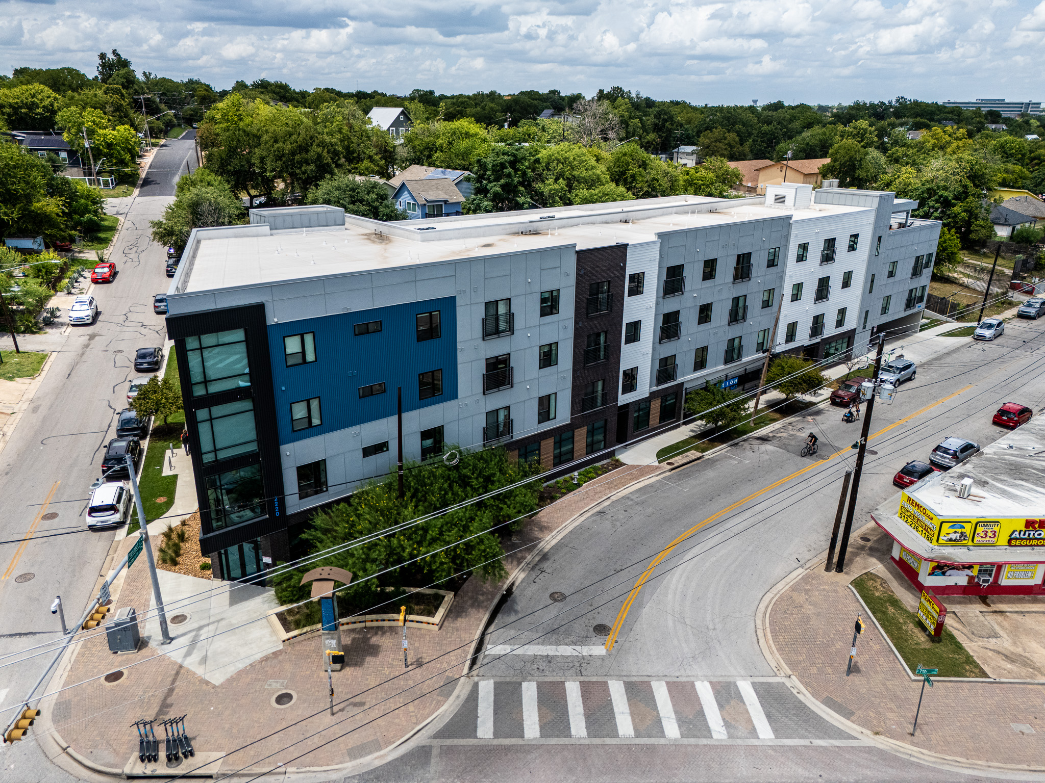 2220 Webberville Road, Unit 202 Austin, TX 78702 - Photo 24 of 27 A modern multi-story residential building commands a prominent corner location near urban conveniences.