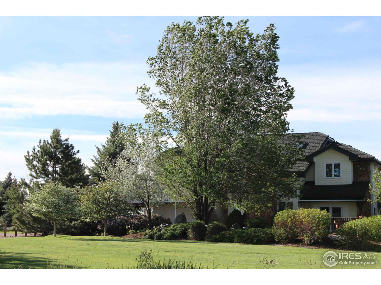 9257 Gunbarrel Ridge Road Boulder, CO 80301 - Photo 1 of 21 a view of a house with a yard
