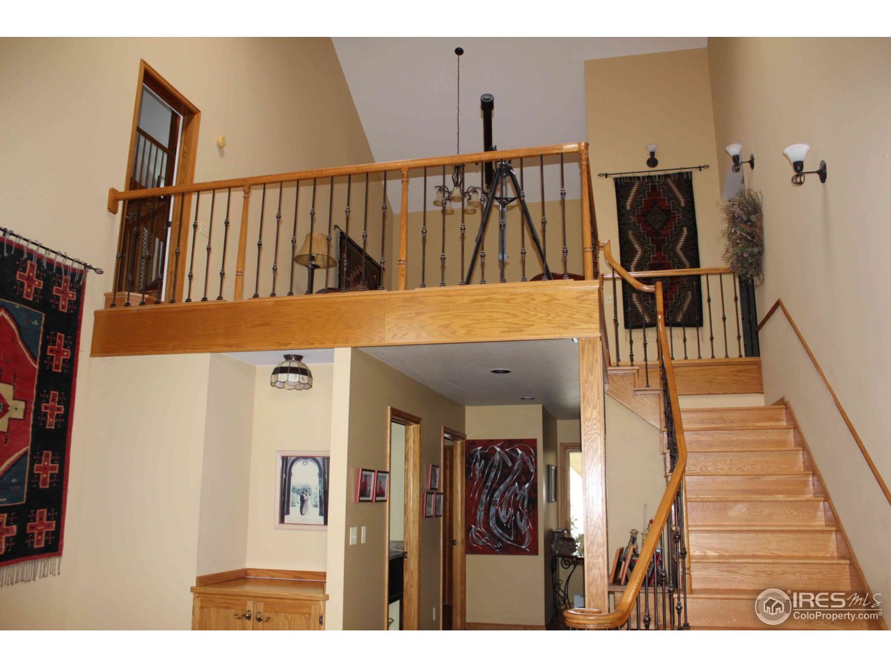 9257 Gunbarrel Ridge Road Boulder, CO 80301 - Photo 11 of 21 a view of a hallway with wooden floor and staircase