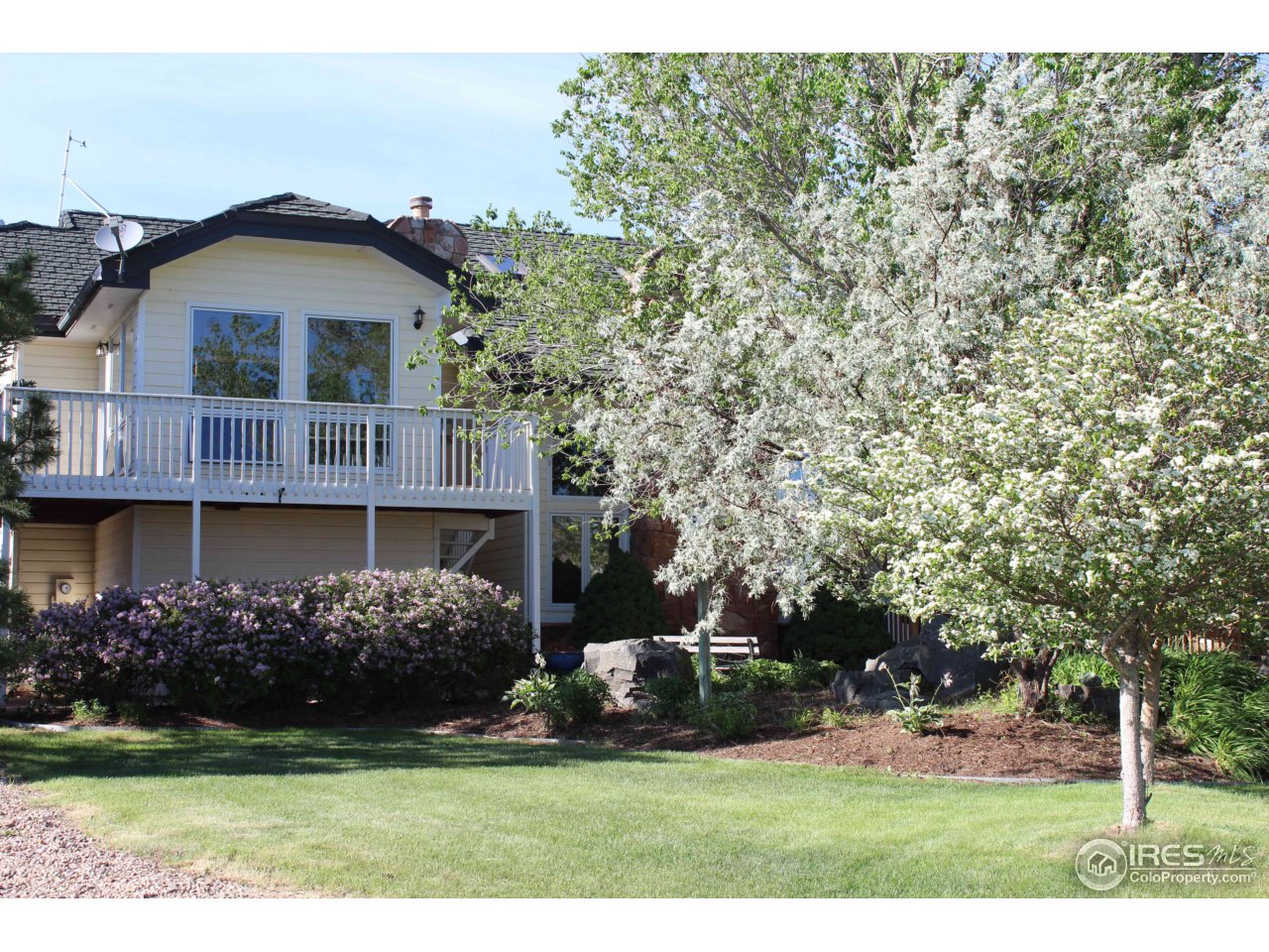 9257 Gunbarrel Ridge Road Boulder, CO 80301 - Photo 2 of 21 a front view of a house with a garden