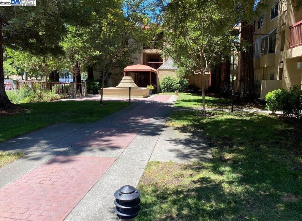 1310 Walden Road, Unit 11 Walnut Creek, CA 94597 - Photo 20 of 26 a front view of a house with a yard
