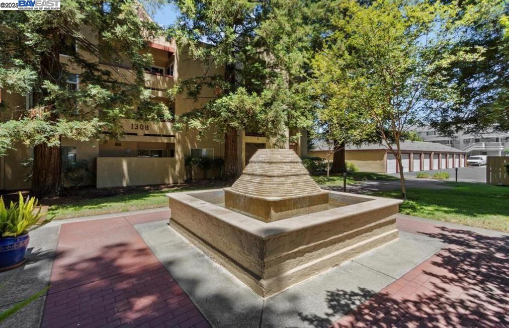 1310 Walden Road, Unit 11 Walnut Creek, CA 94597 - Photo 25 of 26 a view of a house with a yard